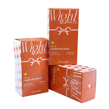 Load image into Gallery viewer, English Breakfast holiday tea box, alternate view of three boxes stacked on and next to one another. One box lays on it's side with another box stacked upright ontop of it. Another box next to them also stands upright.