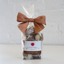 Load image into Gallery viewer, Packaged treats with a brown bow on a light gray background
