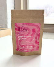 Load image into Gallery viewer, Kraft resealable stand-up pouch with pink label featuring 'Wight Tea Co.' sitting on a white surface.
